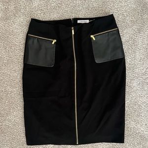Calvin Klein black skirt, faux leather details. New without tags